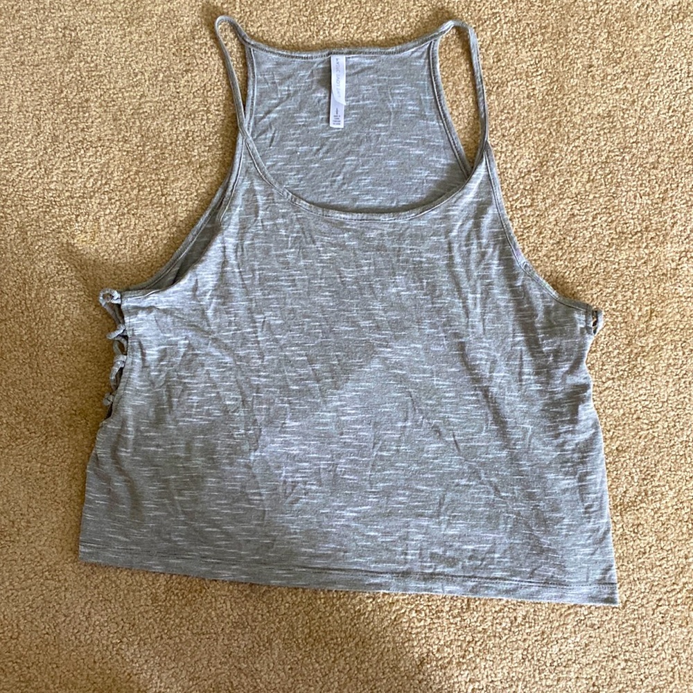 Kids size large LIGHTLY WORN athletic tank top. Could fit a XS-S woman as well!!